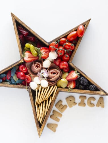 A star shaped wooden board with a simple 4th of July Charcuterie Board.