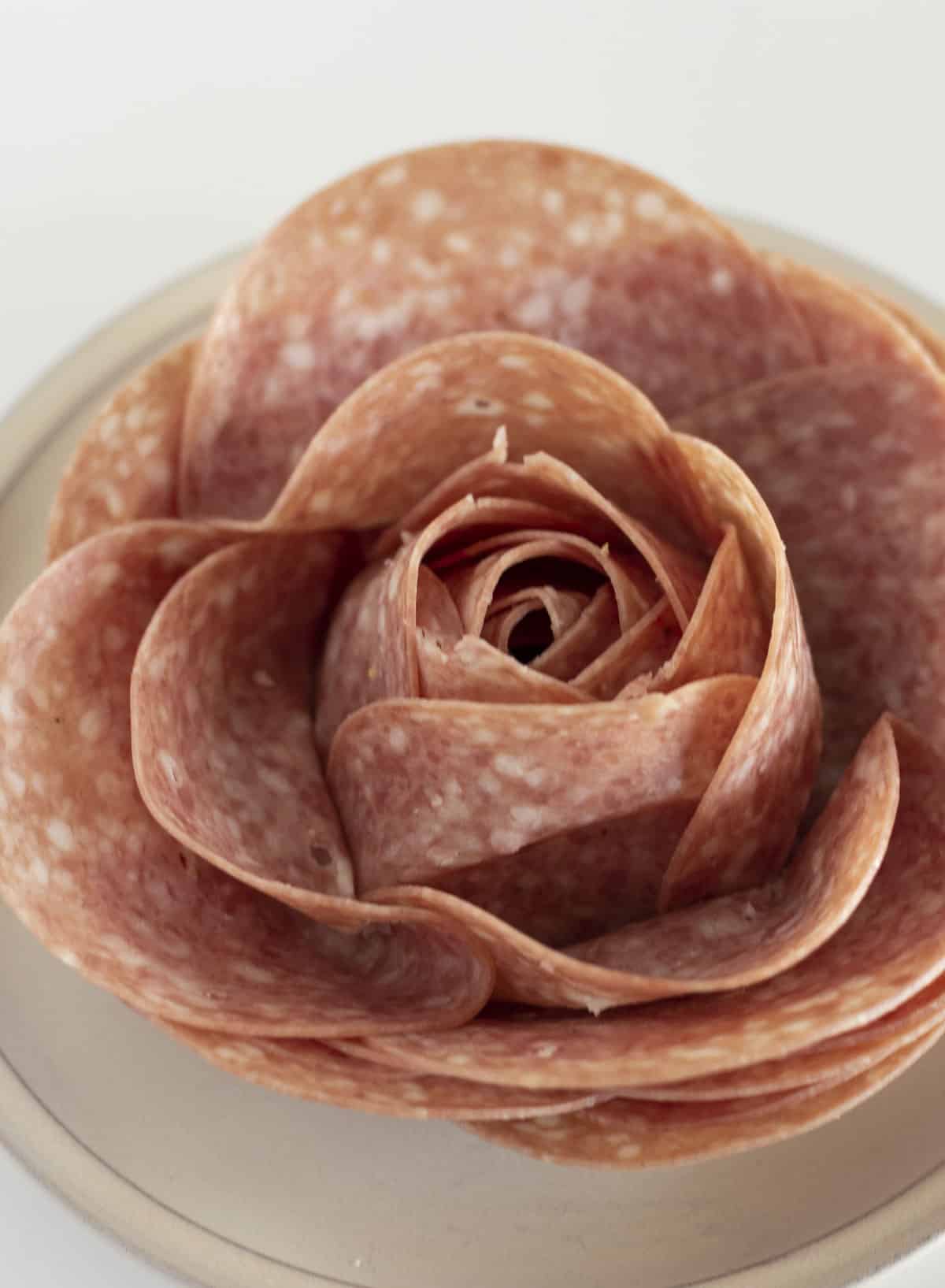 A close up photo of a salami rose.