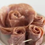 Two sizes of roses made with salami.