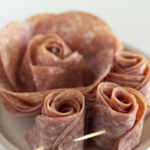 Two sizes of roses made with salami.