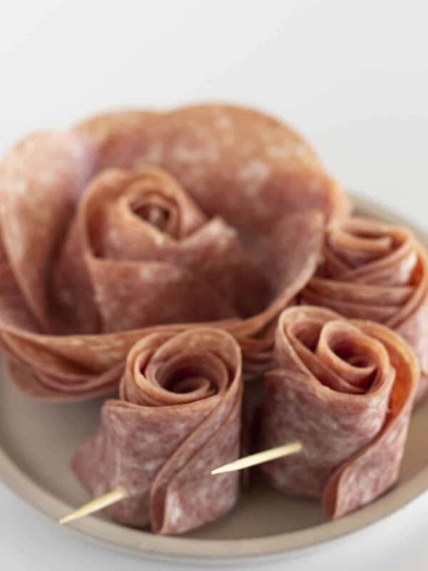 Two sizes of roses made with salami.