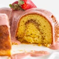 Looking inside at the strawberry swirl of this Strawberry Lemonade Bundt Cake.