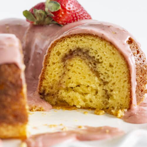Looking inside at the strawberry swirl of this Strawberry Lemonade Bundt Cake.