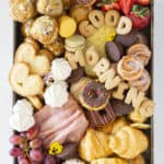 A charcuterie board full of breakfast items.