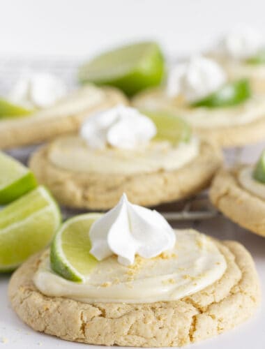 A dozen Key Lime Cookies on a cooling rack.