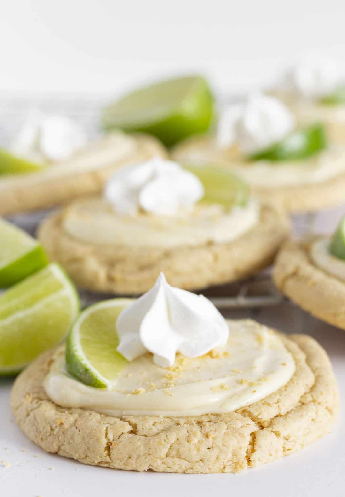 A dozen Key Lime Cookies on a cooling rack.