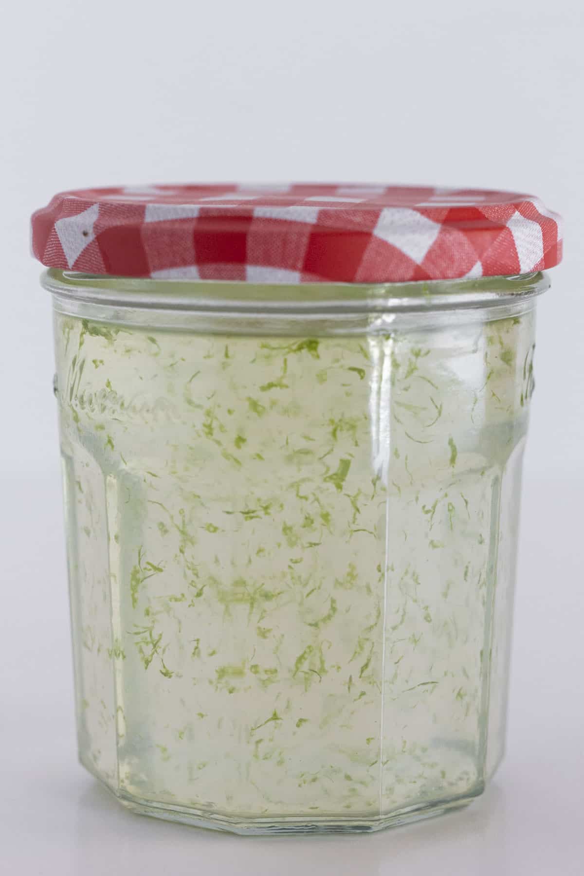 A jar of lime simple syrup ready to be used.