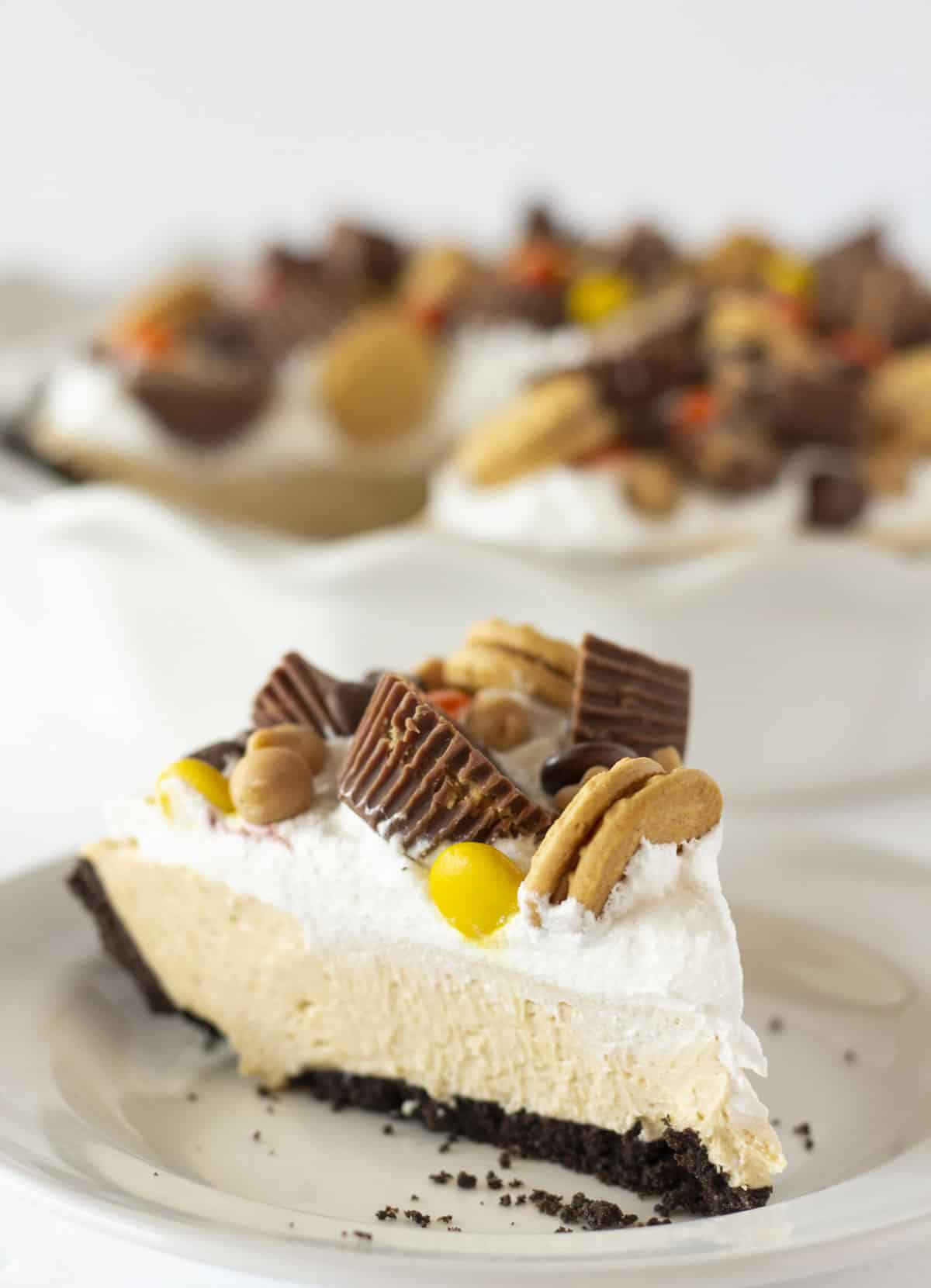 Serving a piece of easy no bake peanut butter pie.