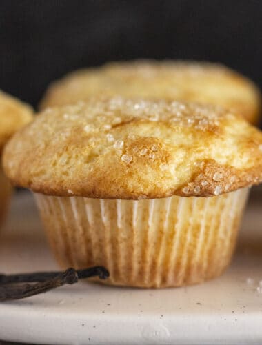 A close up of a freshly baked vanilla muffin.