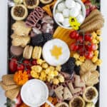A fall charcuterie board on a galvanized tray.