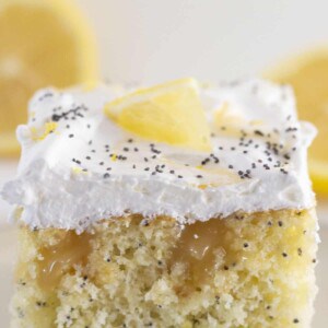 A square of cake on a plate.