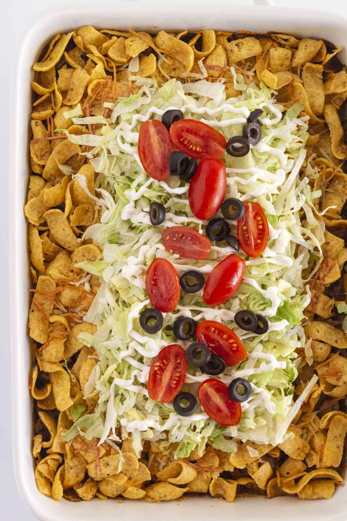 Looking down on a whole baked walking taco casserole.