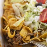 Serving a walking taco casserole.