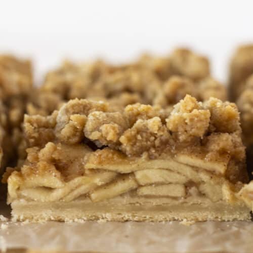 Dutch apple pie bars that have just been cut into squares.