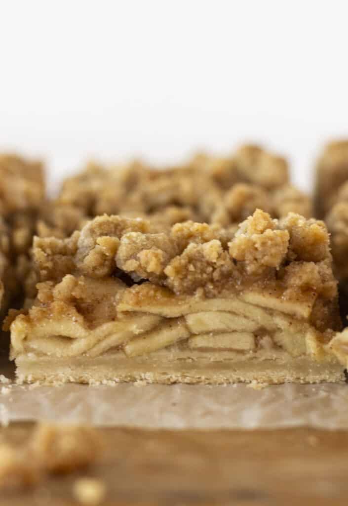 Dutch apple pie bars that have just been cut into squares.