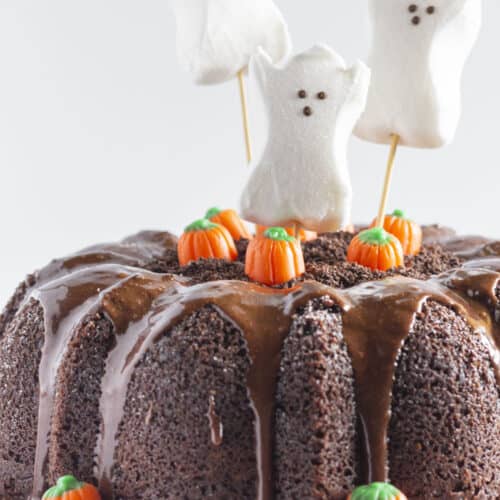 A Halloween Bundt Cake with ghosts and pumpkins.