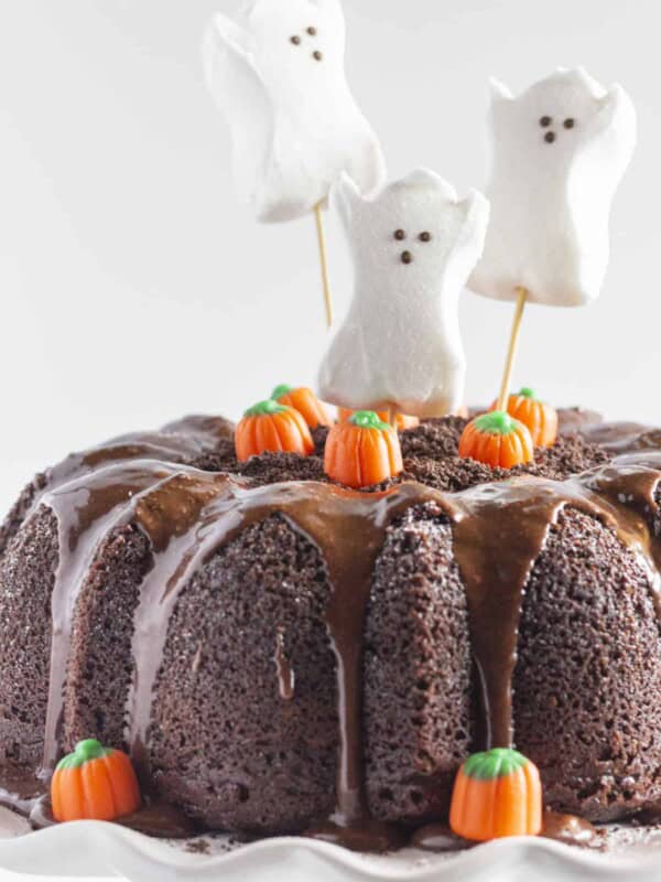 A Halloween Bundt Cake with ghosts and pumpkins.