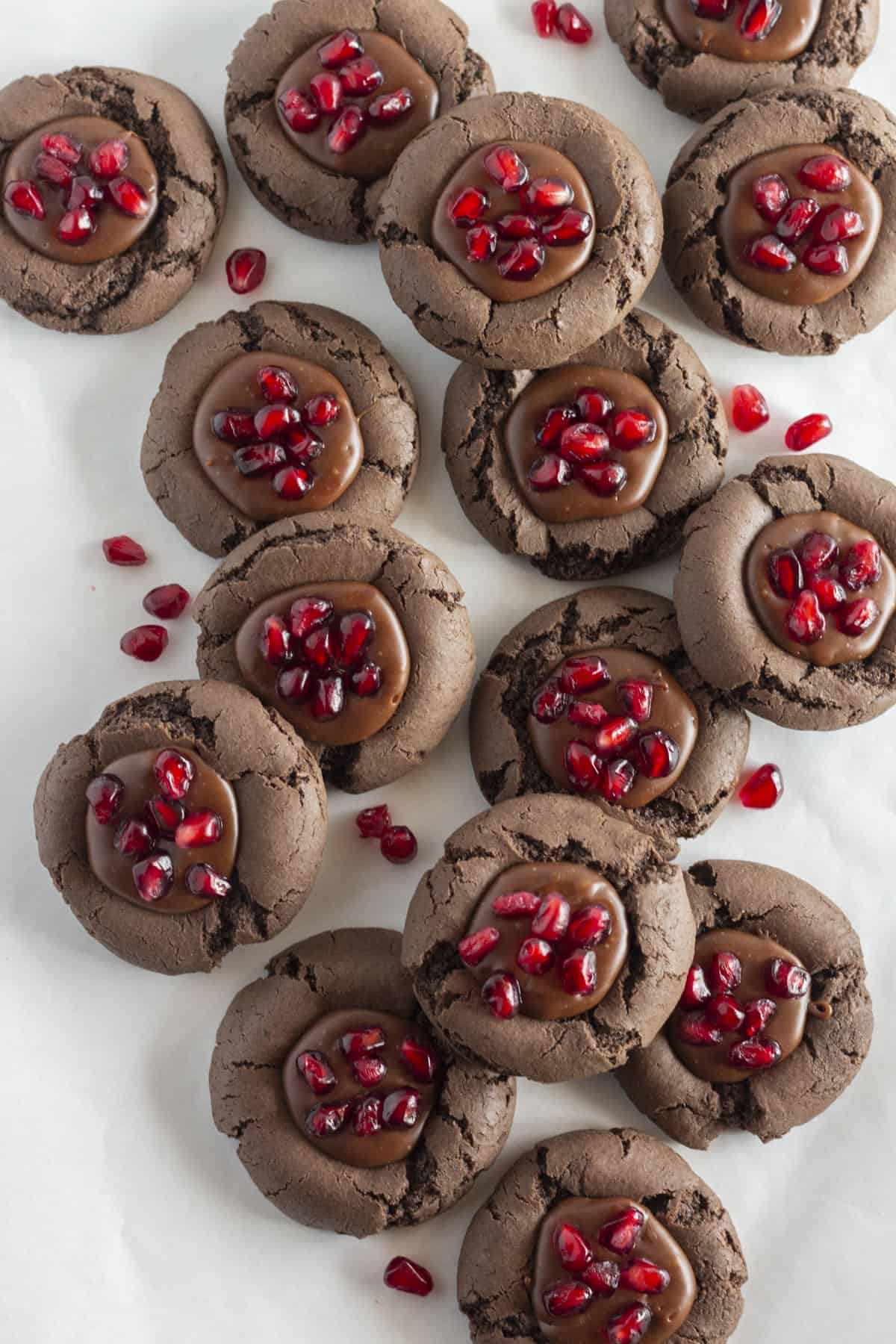 Looking down on a dozen chocolate pomegranate cookies.