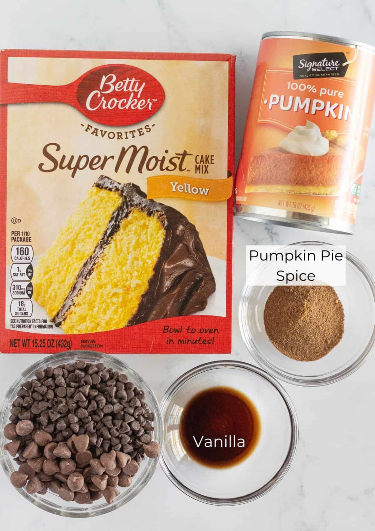 The ingredients needed to make pumpkin chocolate chip cookies.