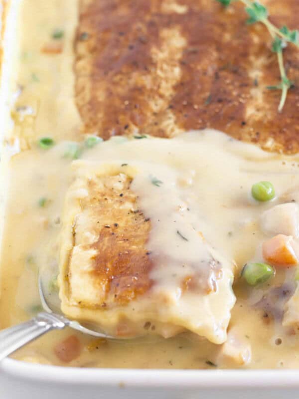 Serving turkey pot pie with puff pastry.