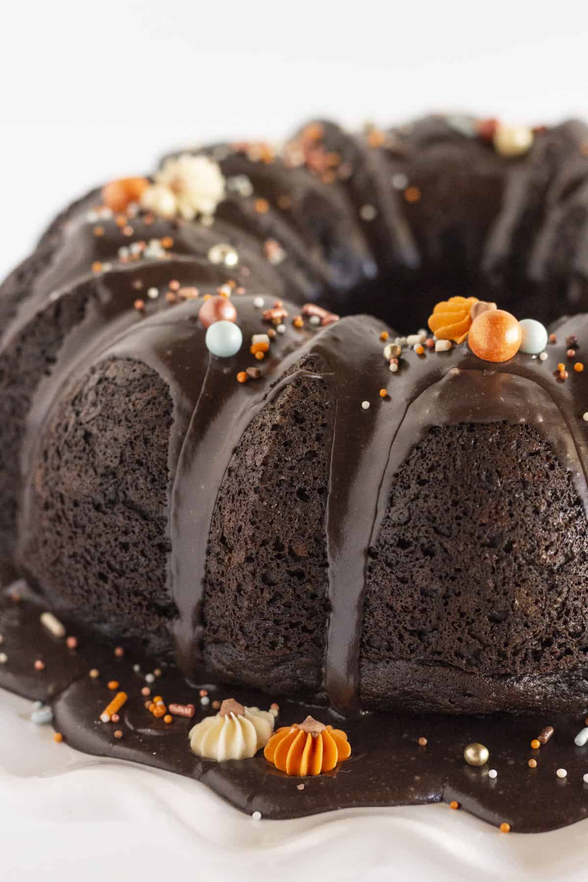 A finished black velvet cake with fall sprinkles.