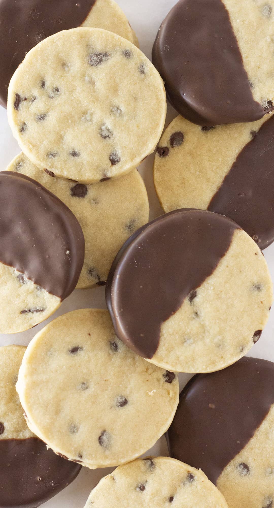 Chocolate chip shortbread cookies on a white plate.