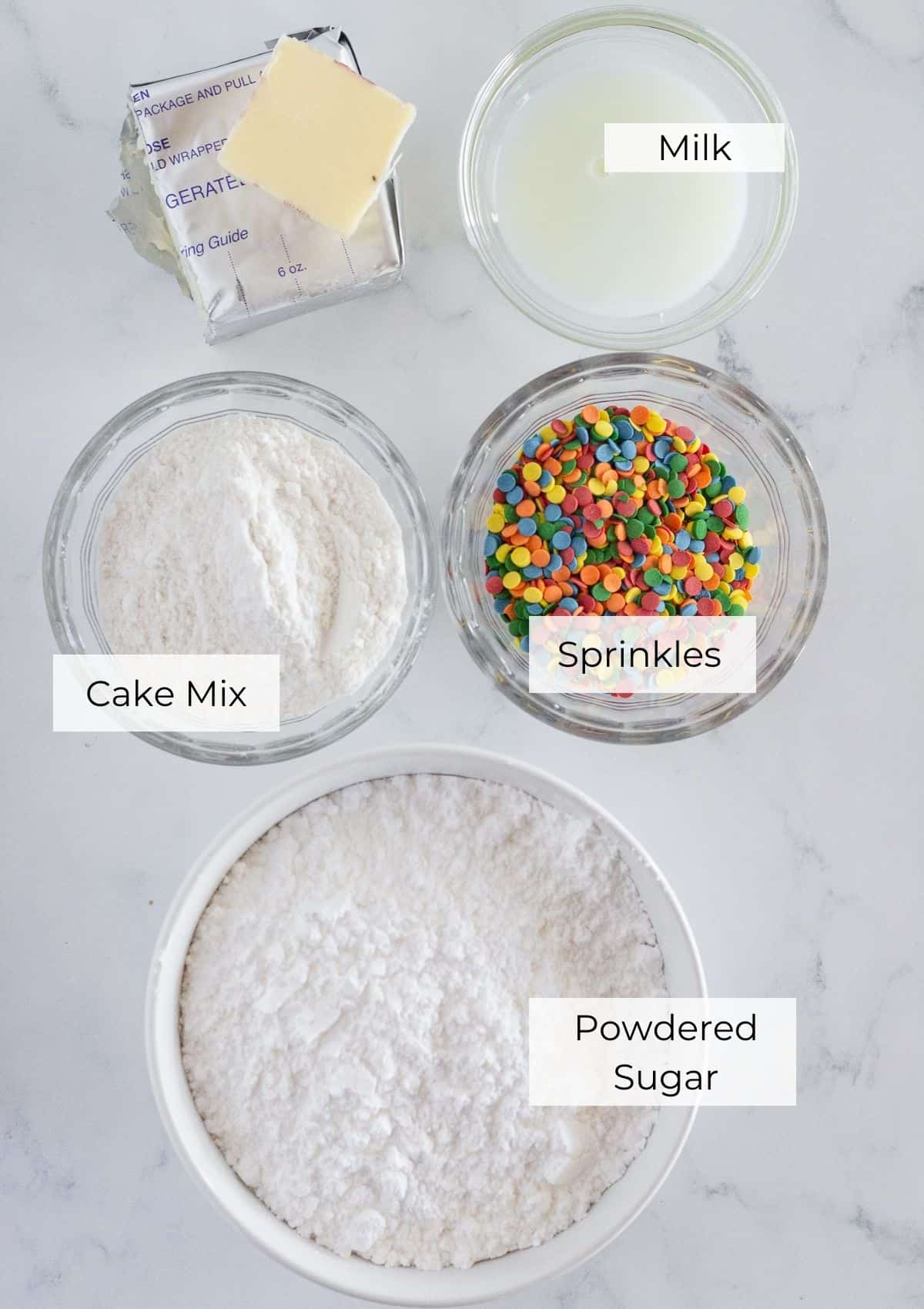 The ingredients needed to make a cream cheese cake batter frosting.