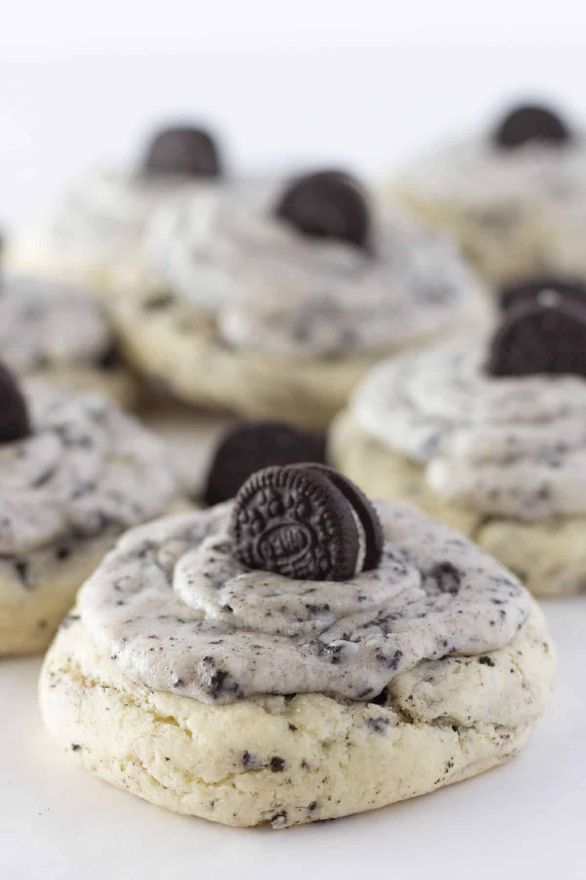 Cookies and cream cookies on a white tray with mini cookies on top.