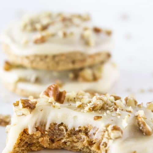 Carrot cake mix cookies with cream cheese glaze and chopped pecans.