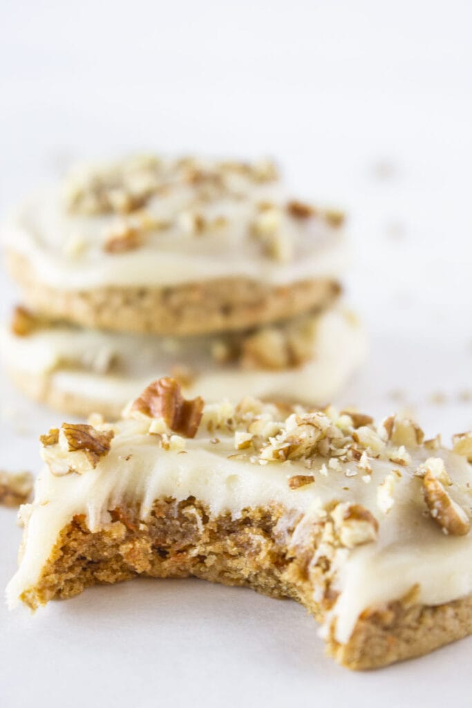 Carrot cake mix cookies with cream cheese glaze and chopped pecans.