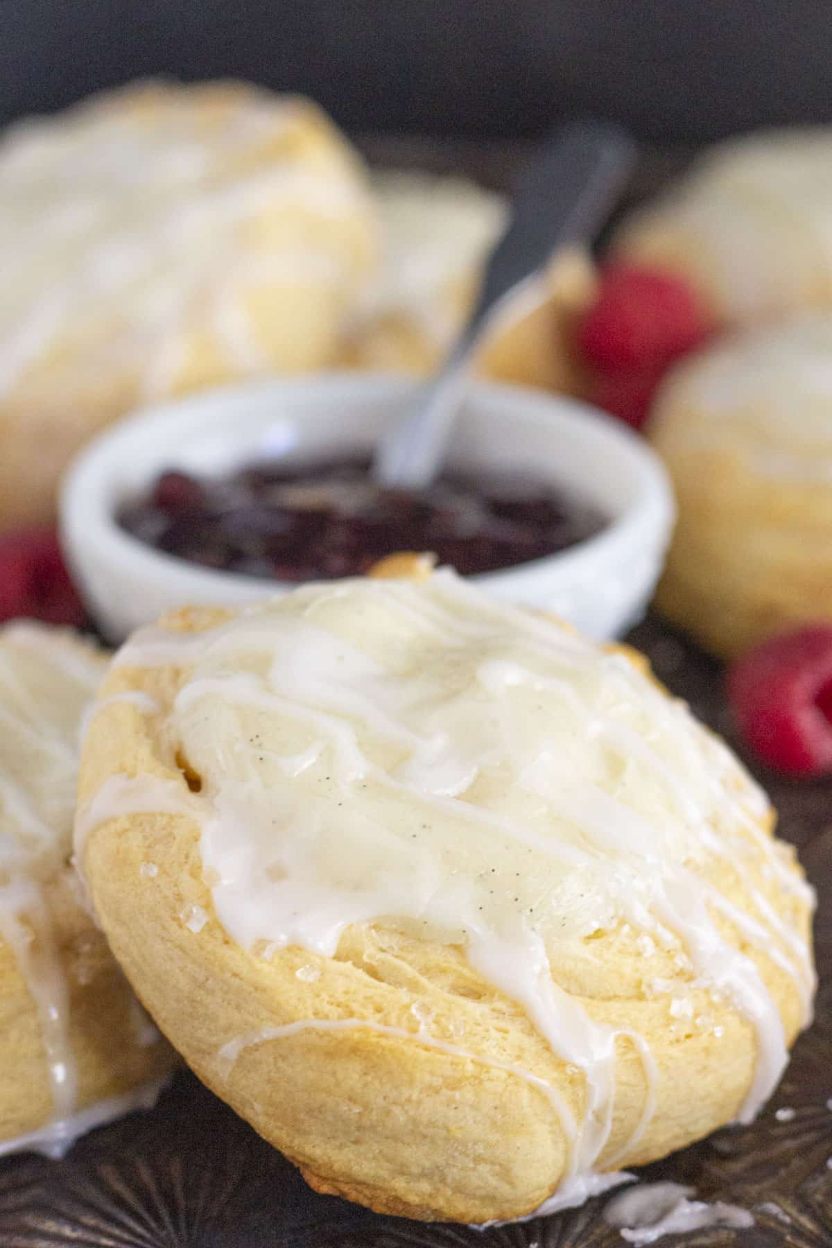 A tray of crescent roll cream cheese danishes with raspberry jam.
