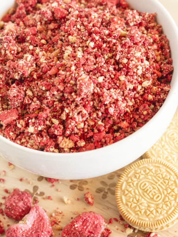 Strawberry crunch topping in a white bowl.