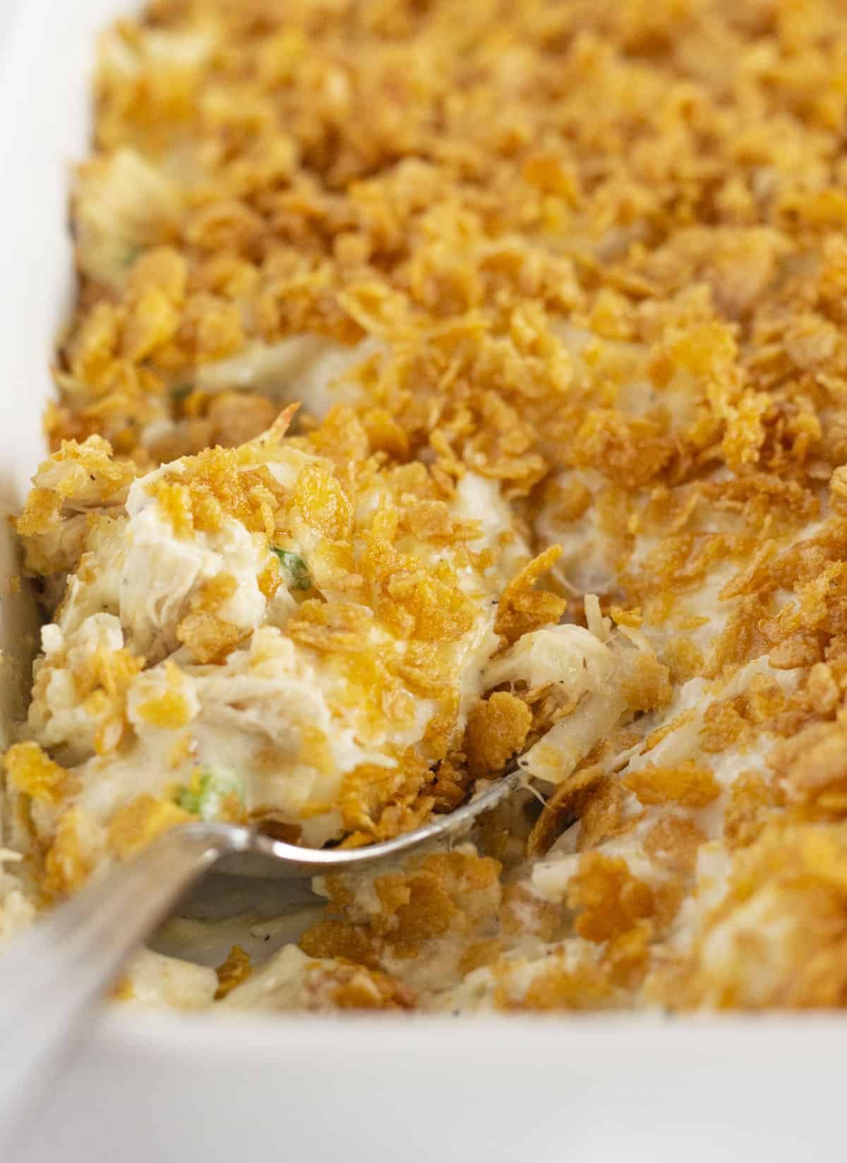 A baked chicken and hashbrown casserole with cornflake topping.