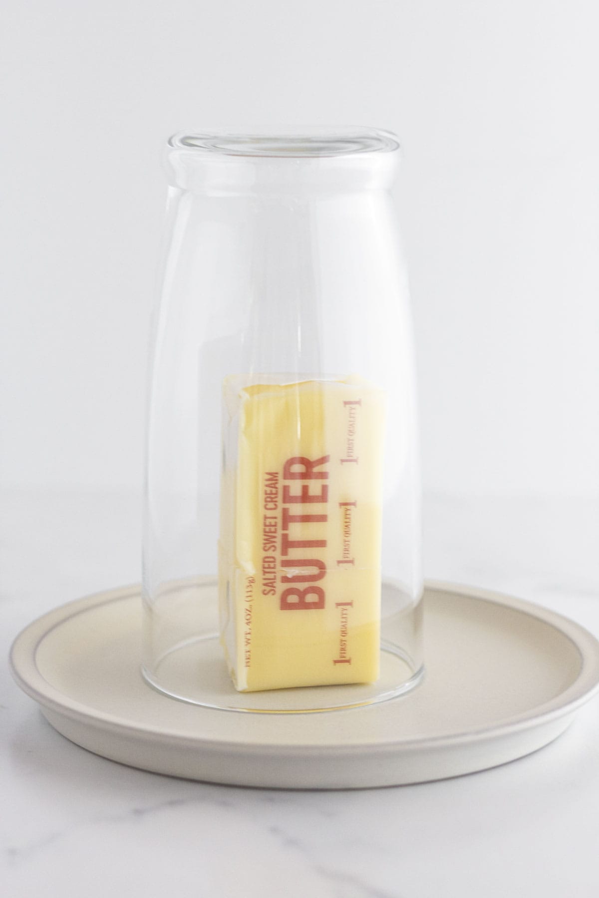 A warm cup over a stick of butter to bring it to room temperature.
