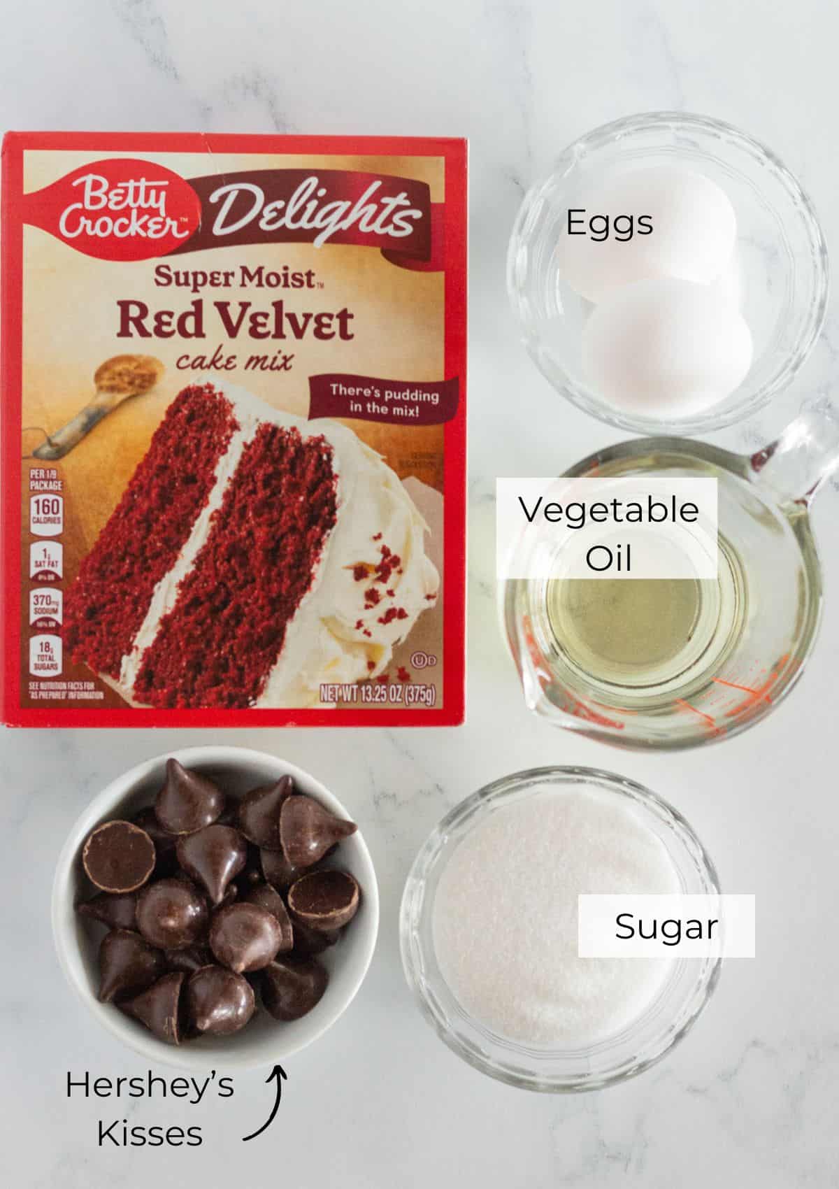 The ingredients needed to make Red Velvet Kiss Cookies.