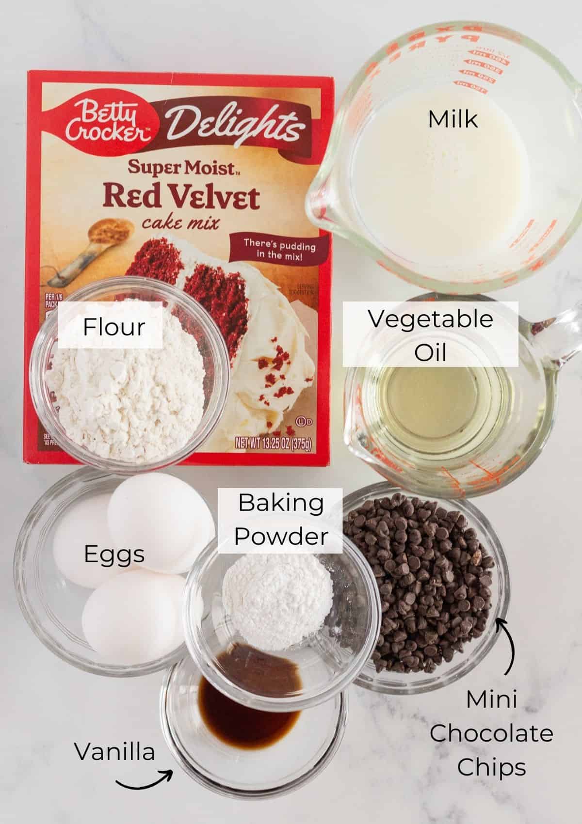 The ingredients needed to make red velvet muffins with chocolate chips.