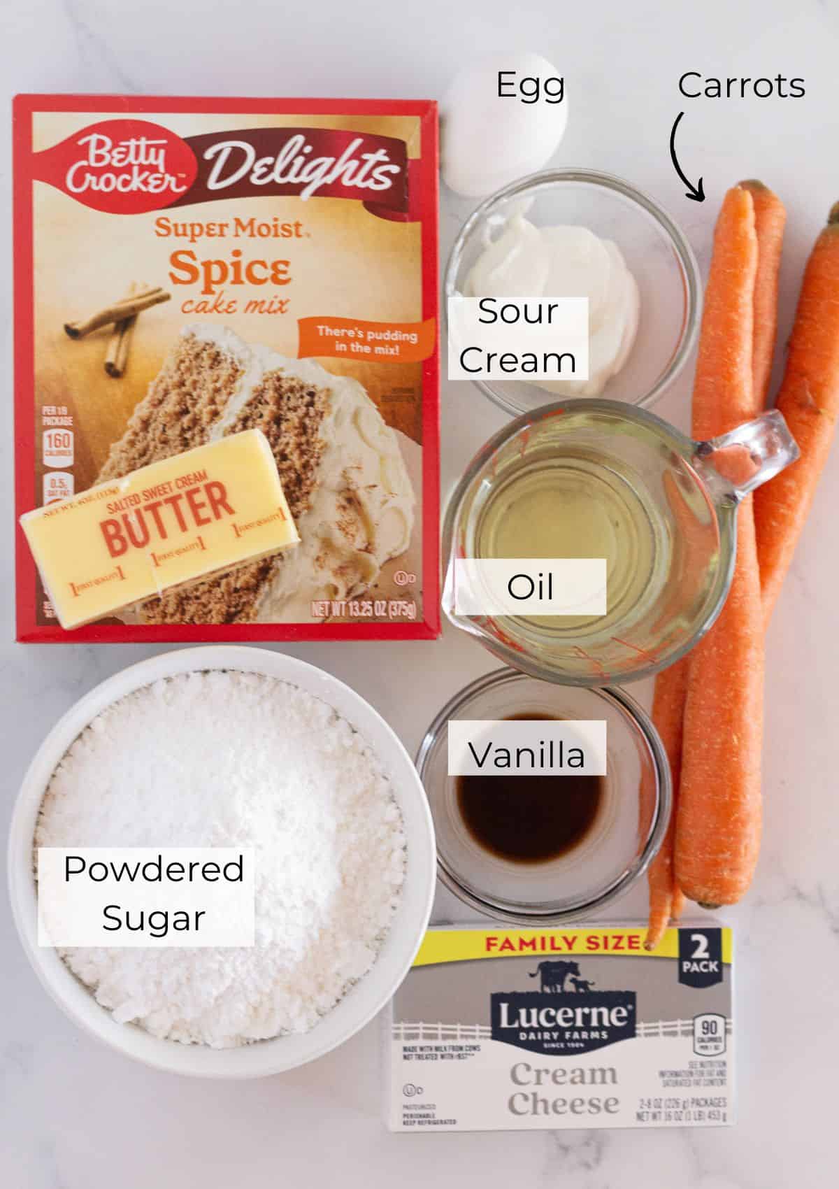 The ingredients needed to make cake mix carrot cake cookies with cream cheese frosting.