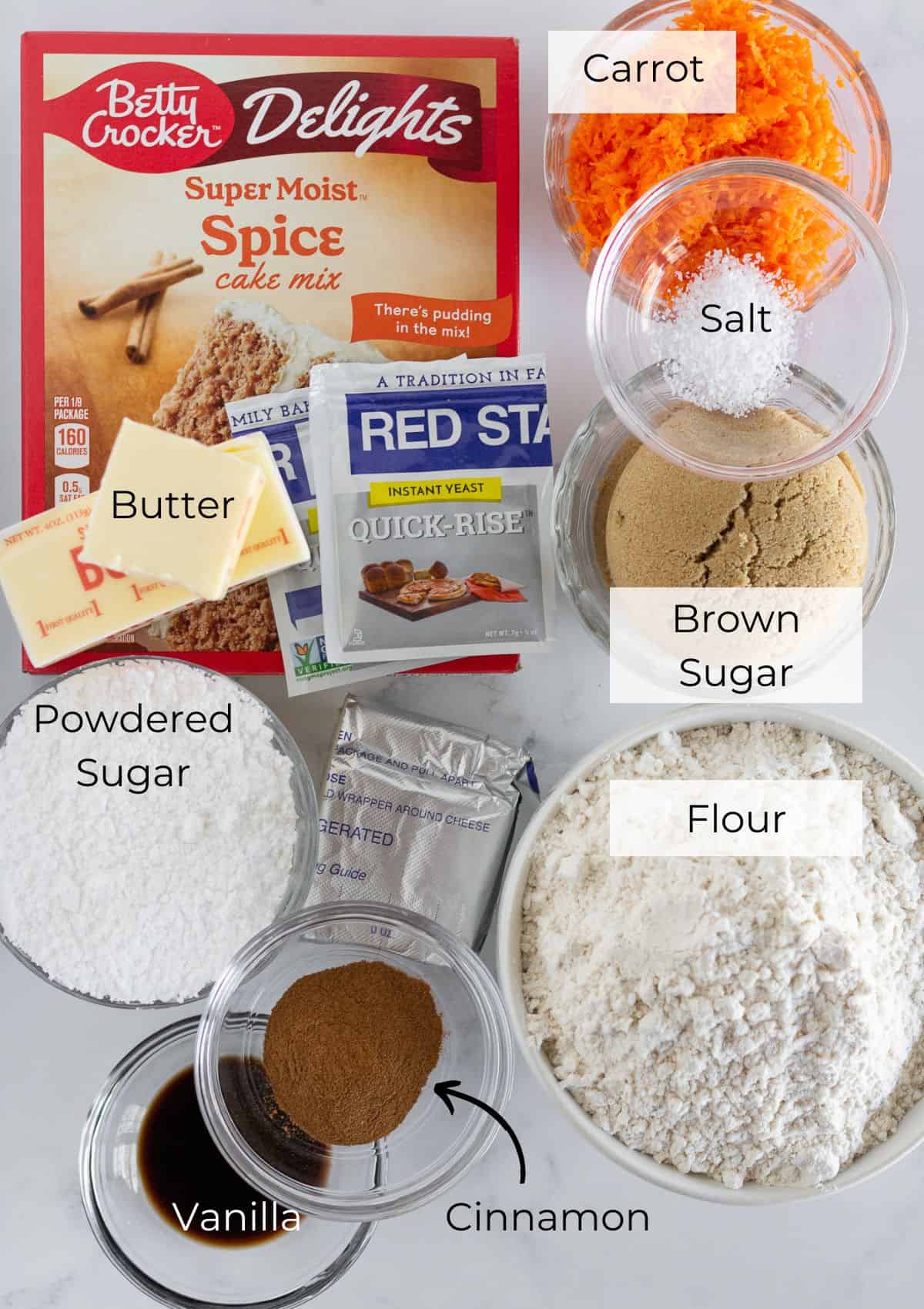 The ingredients needed to make carrot cake cinnamon rolls.