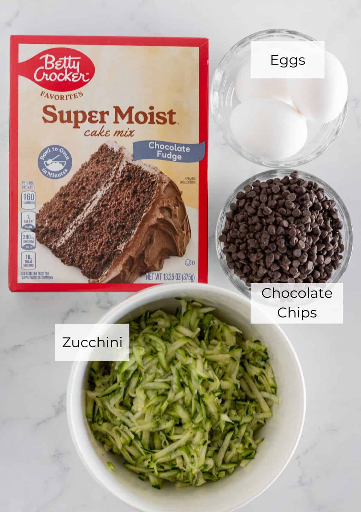 The ingredients needed to make chocolate zucchini loaf.
