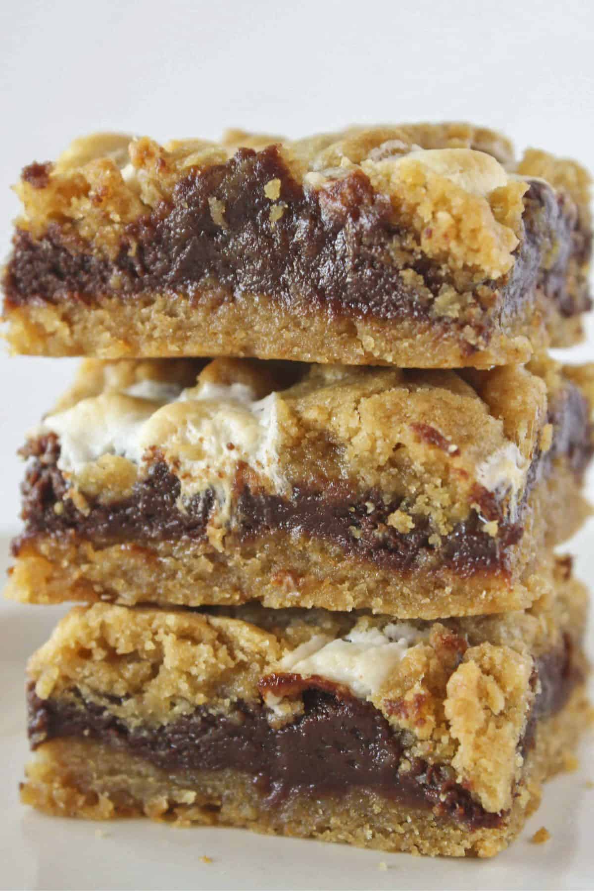 Three s'mores cookie bars stacked on each other.