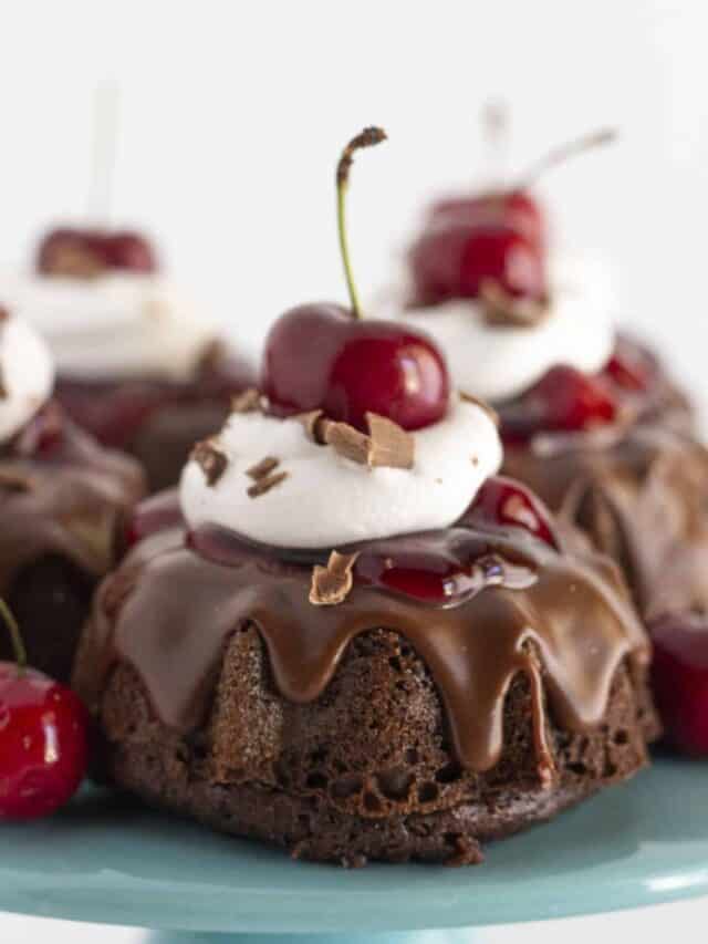 Mini black forest cakes with cherry pie filling, whipped topping and chocolate shavings.