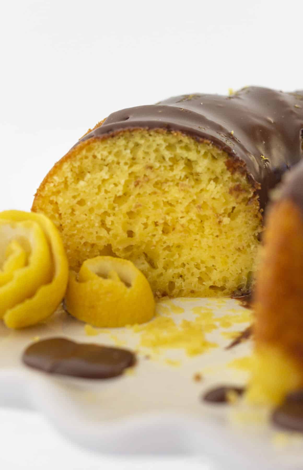 Looking at the inside of a lemon cake with chocolate ganache.