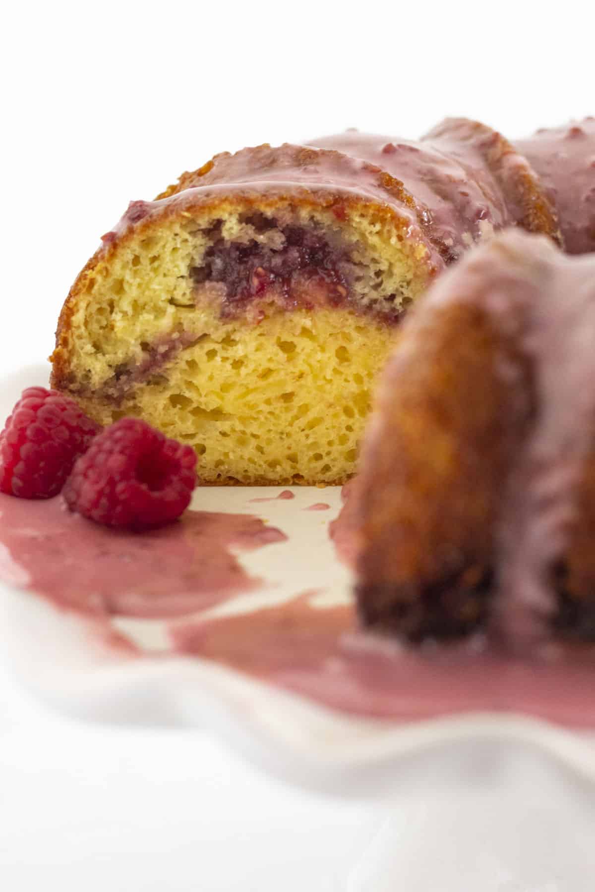 The inside of a raspberry lemonade cake with raspberry filling.