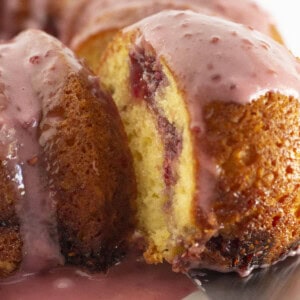 Serving a piece of raspberry lemonade bundt cake.
