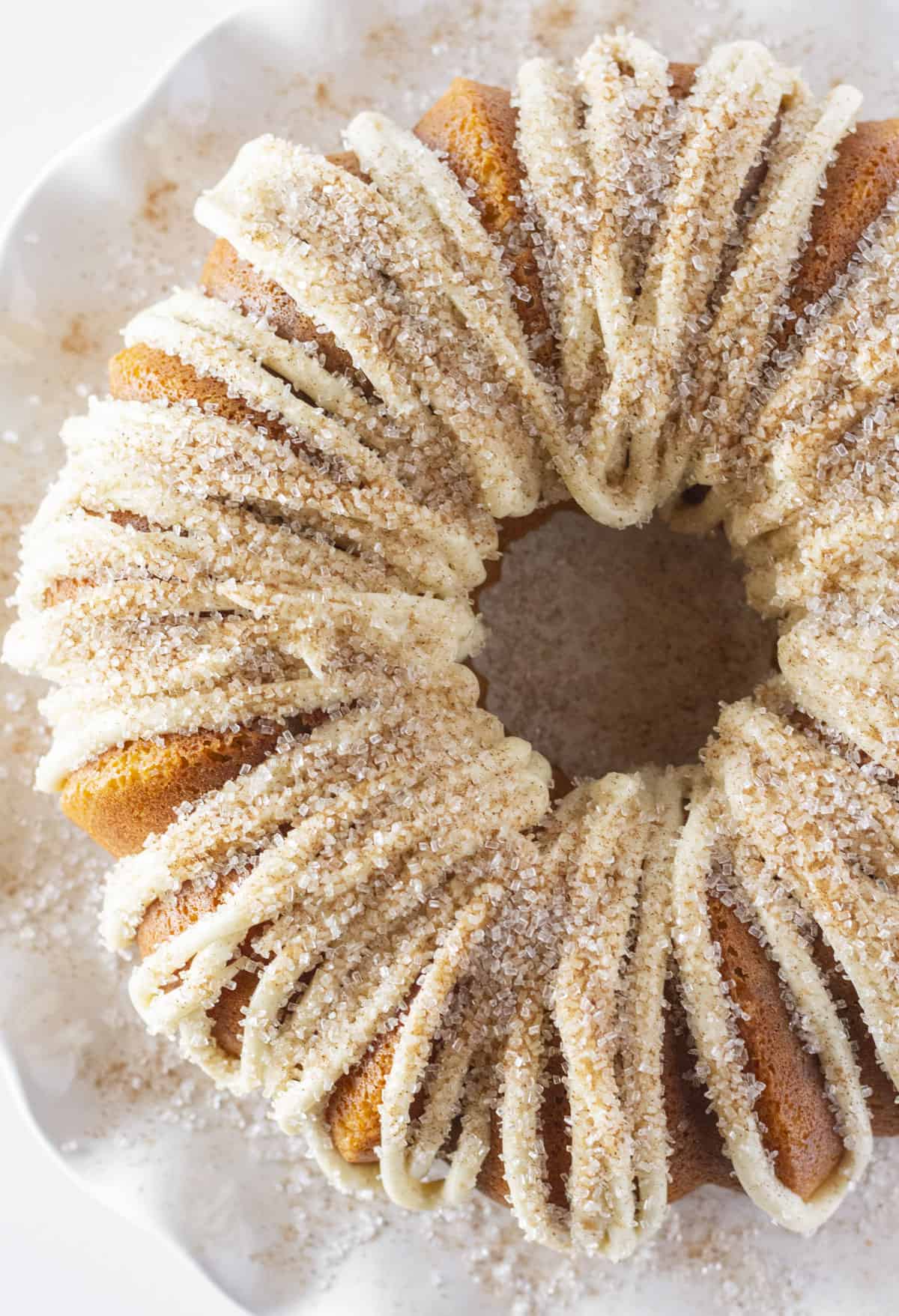 Looking down on a whole Snickerdoodle Bundt Cake with cinnamon sugar topping.