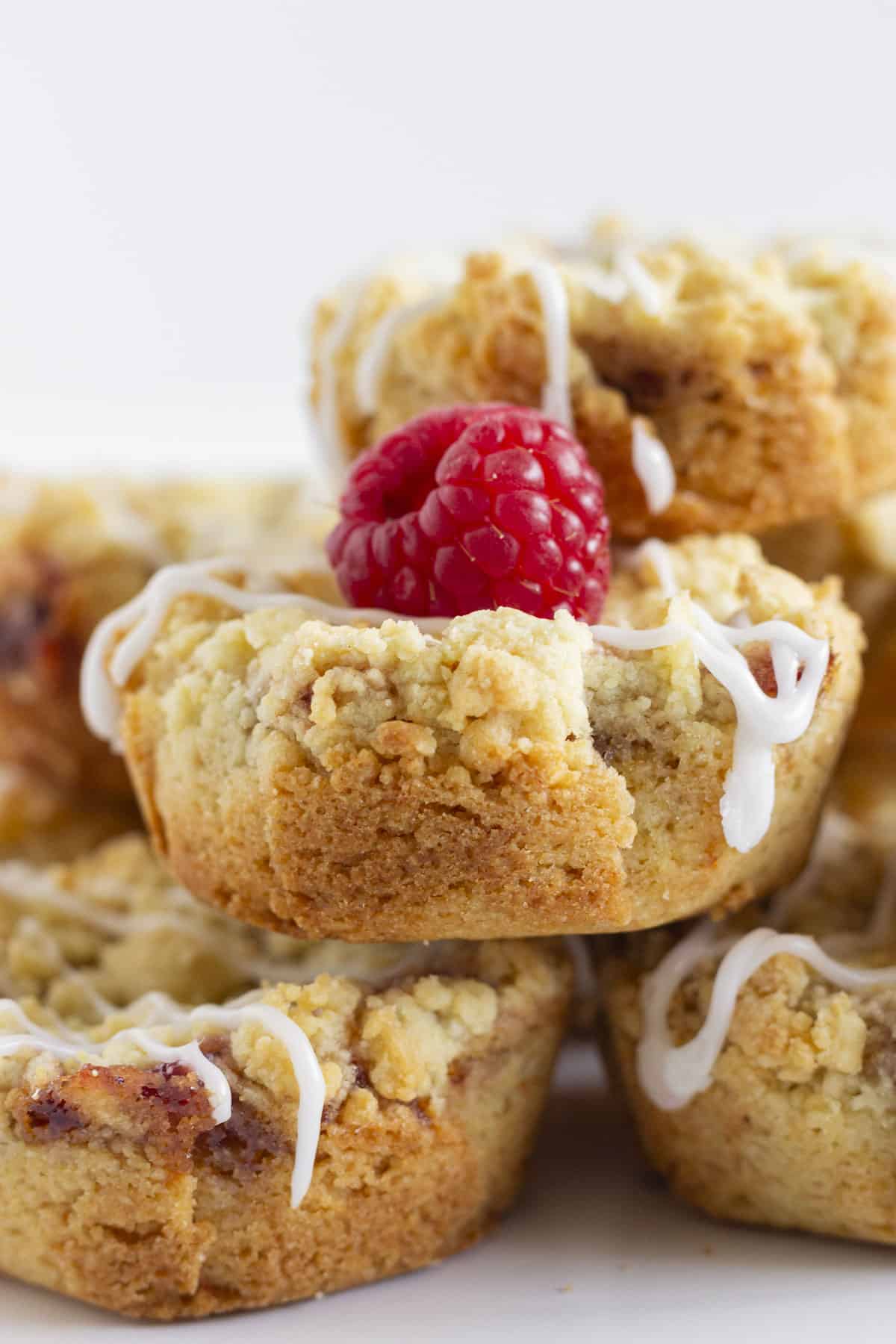 Raspberry crumble cookies stacked on each other.