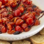 Fresh homemade bruschetta dip on creamy ricotta.