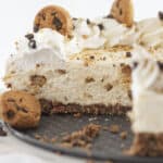 Looking inside a chocolate chip cookie cheesecake once a few pieces are removed.