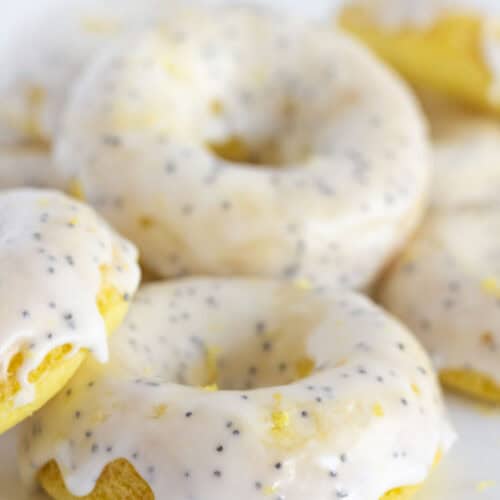 Serving lemon donuts with poppy seed dressing on a white tray.