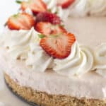 A fresh strawberry no bake cheesecake that is ready to serve.